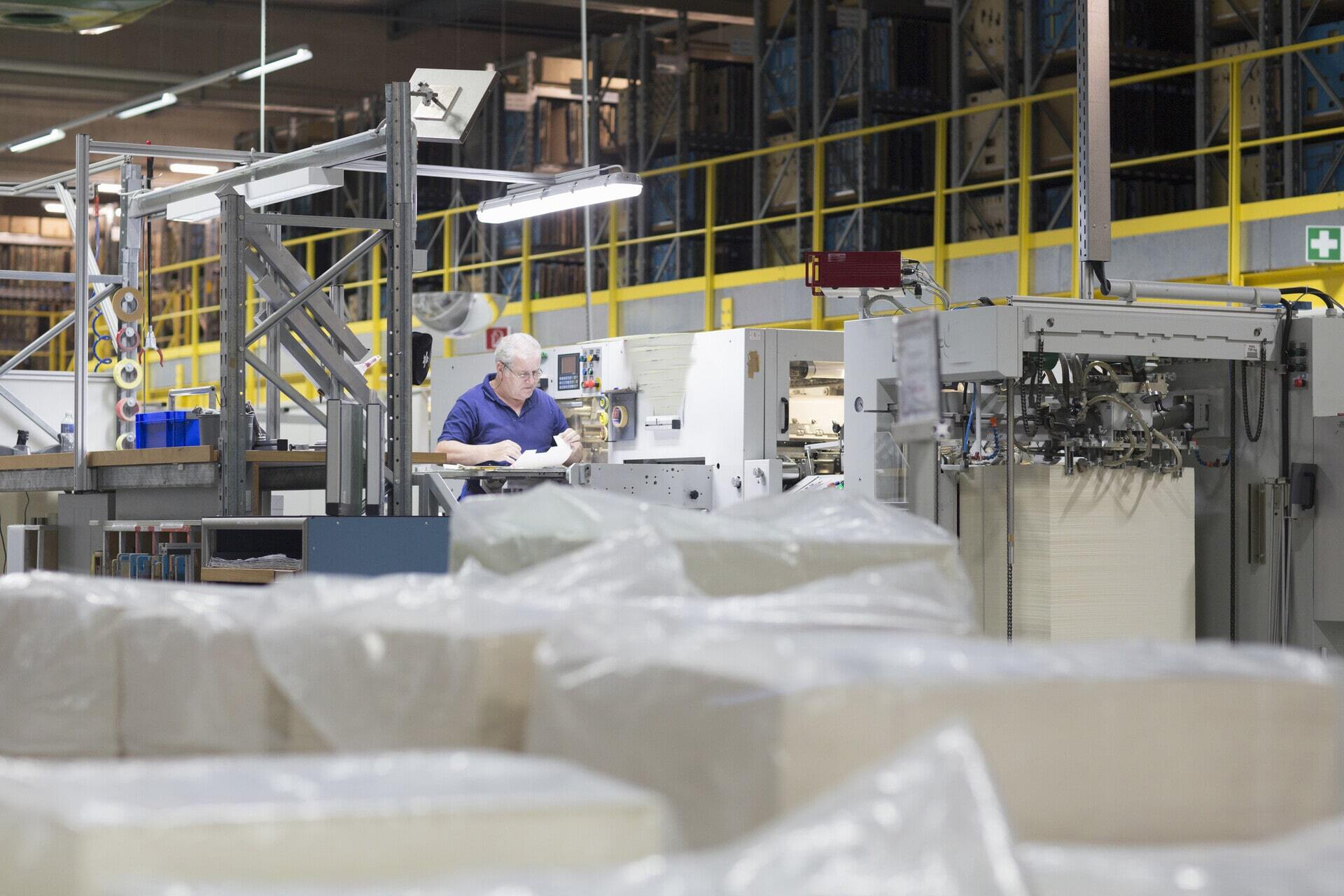 worker-using-machine-in-paper-packaging-factory-2025-04-04-06-28-52-utc-min